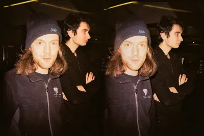 Two of our lovely students. One is looking at the camera, the student in the back looks to the right, off camera. Color corrected a bit for the harsh frontal flash.