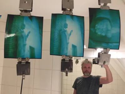 Three images of a statue of Jesus and the Holy Heart. There is only white, green and blue in the image. RA4 paper takes heavy color corrections, this is why C41 negatives have an orange base.