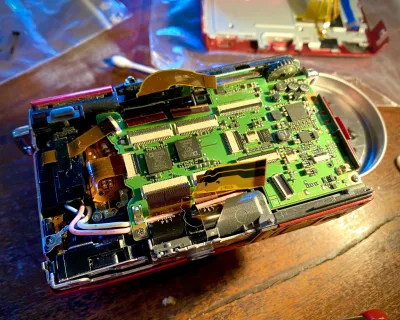 Putting the camera back together again. So many tiny connectors! It is really fiddly.